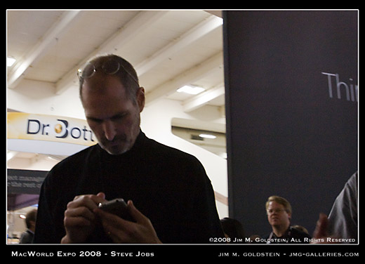 Steve Jobs at MacWorld Checking His iPhone with Robert Scoble lurking in the background