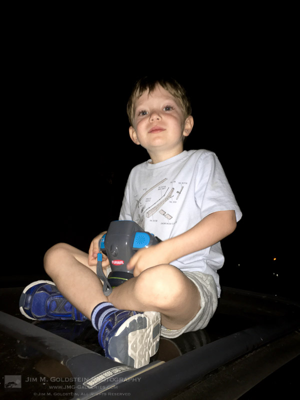 Sitting on the Car Roof Enjoying the View of the Lunar Eclipse